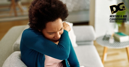 Woman Sneezing into arm