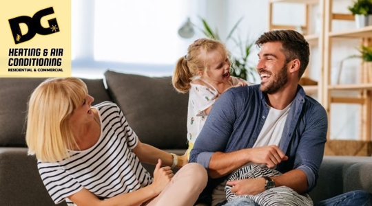 Family laughing on a couch