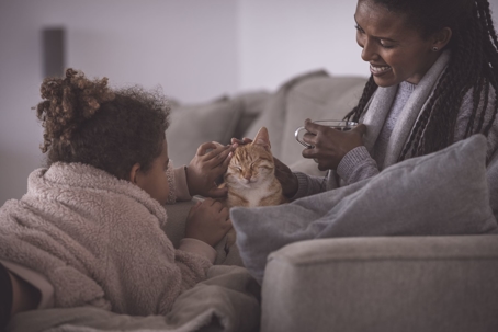 Mother and daughter warmed up spending quality time indoors